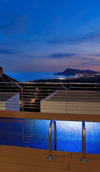 The beauty of the nighttime skyline of Altea and Benidorm from your terrace.